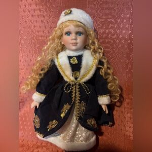 Elegant Black and Gold Doll with Curly Hair